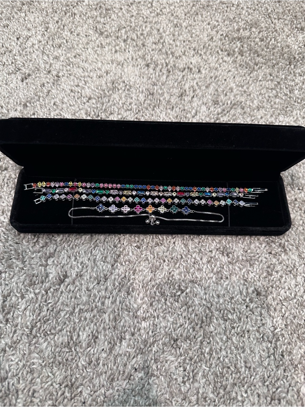 Silver rainbow clover/flower + tenis bracelet stack